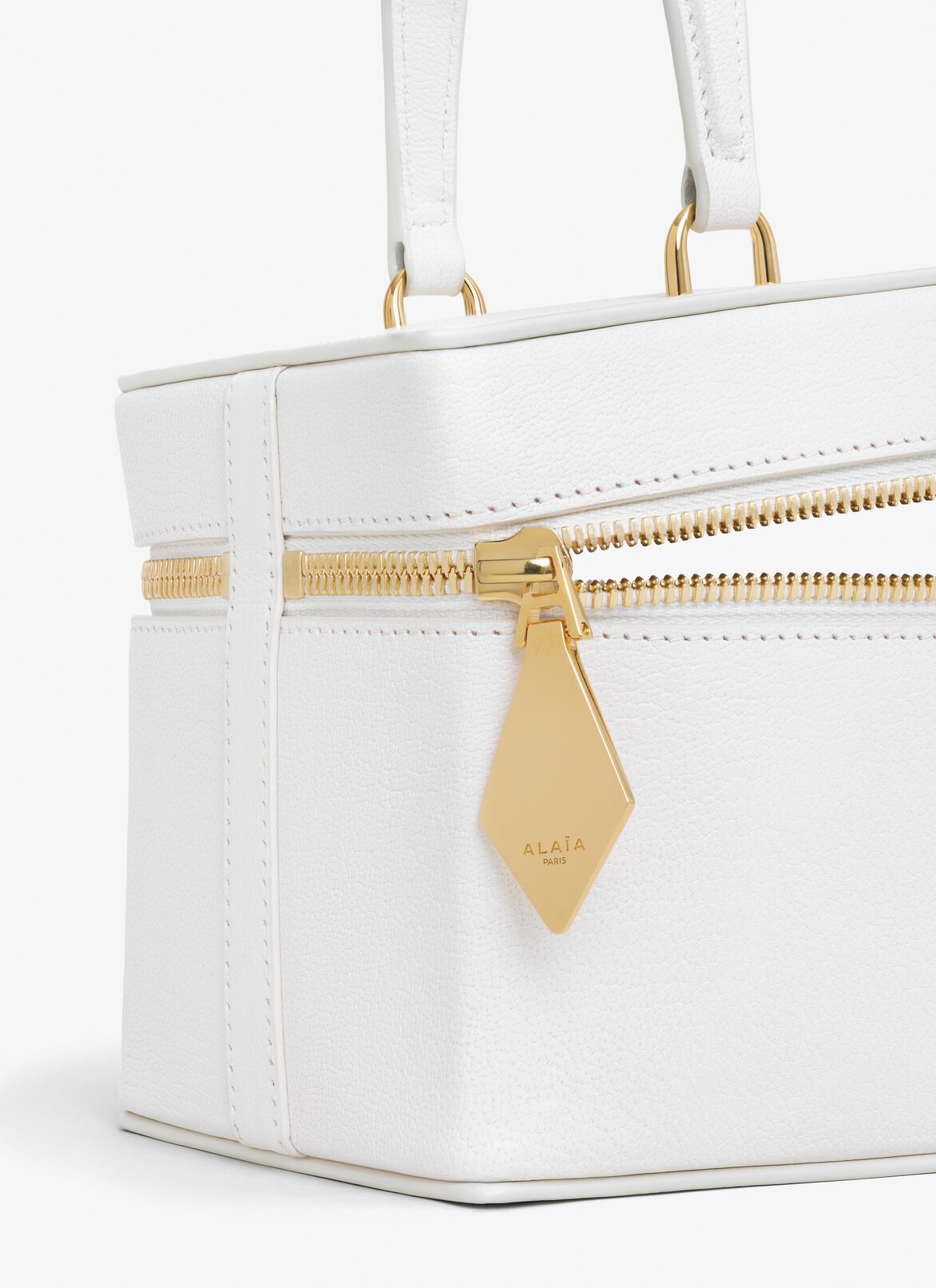 NECESER CUBO DE PIEL DE CABRA BRILLANTE ALAÏA BLANCO NECESER CUBO DE PIEL DE CABRA BRILLANTE